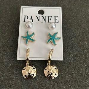 Set of 3 pairs of costume pierced earrings.Never worn.